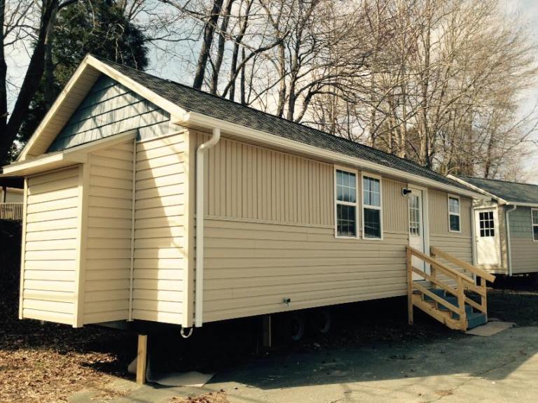 A better photo - the bumpout you see will house the hot water heater, so it's easily accessible to repair without having to rip apart the house from the inside. 
