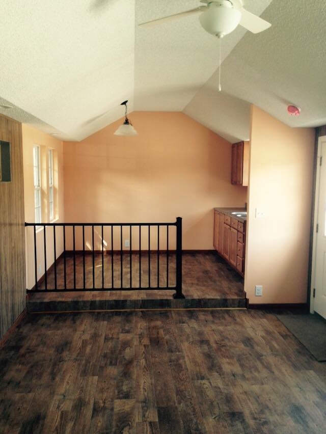 This is the interior of the model house. i will not have wood paneling on the walls, the walls won't be orange, and there will be more cabinets, a stove, a fridge, and a stackable washer and dryer. And more windows. 