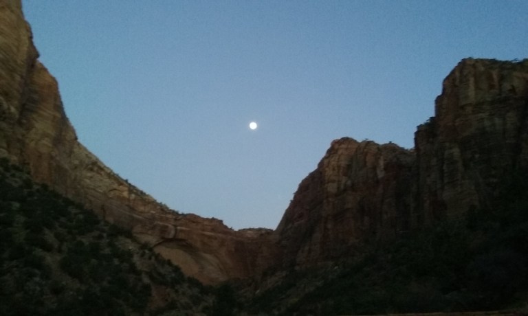 The moon has been exceptionally large the last few days. My phone's camera really doesn't do the view justice. This was taken in Zion where the switchback are, somewhat near the tunnel. Below the moon is the area you get to at the end of Canyon Overlook, where I went once at sunrise. Definitely worth dealing with the cold and darkness that morning.
